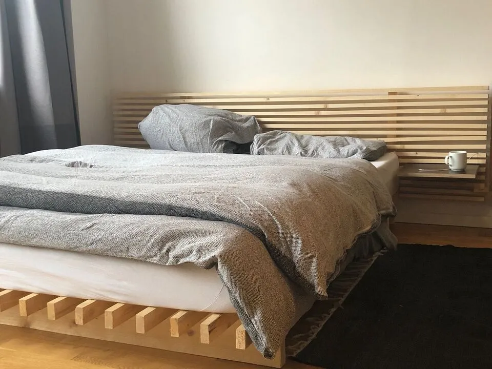 Bed and headboard made from cheap wood laths